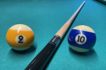9 ball and 10 ball on pool table