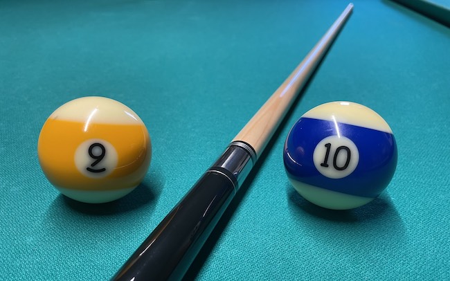 9 ball and 10 ball on pool table