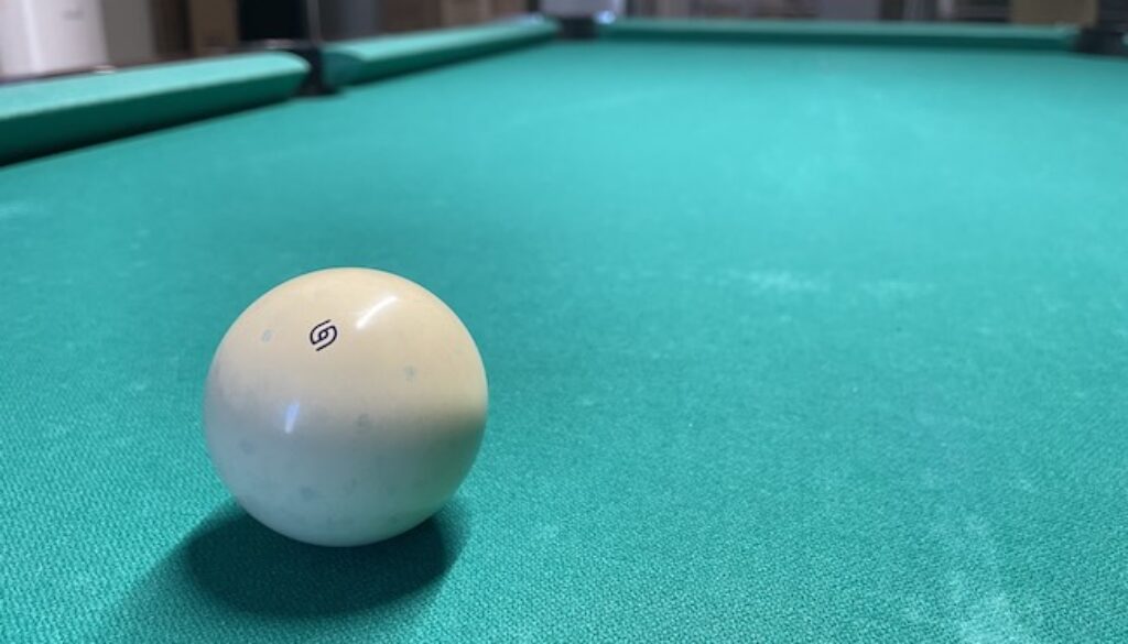 cue ball on pool table