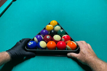 Racking pool balls on a pool table