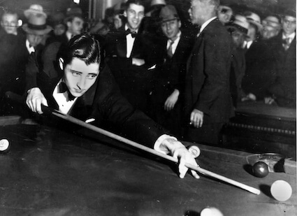 Young Willie Mosconi playing pool