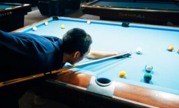 pool player aiming a shot