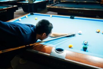 pool player aiming a shot