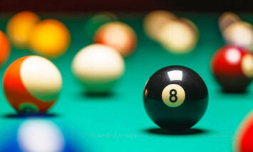 pool balls scattered on pool table