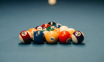 pool balls racked on pool table
