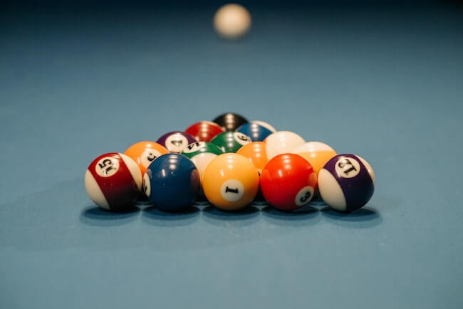 pool balls racked on pool table
